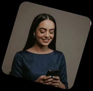 Woman smiling at her phone